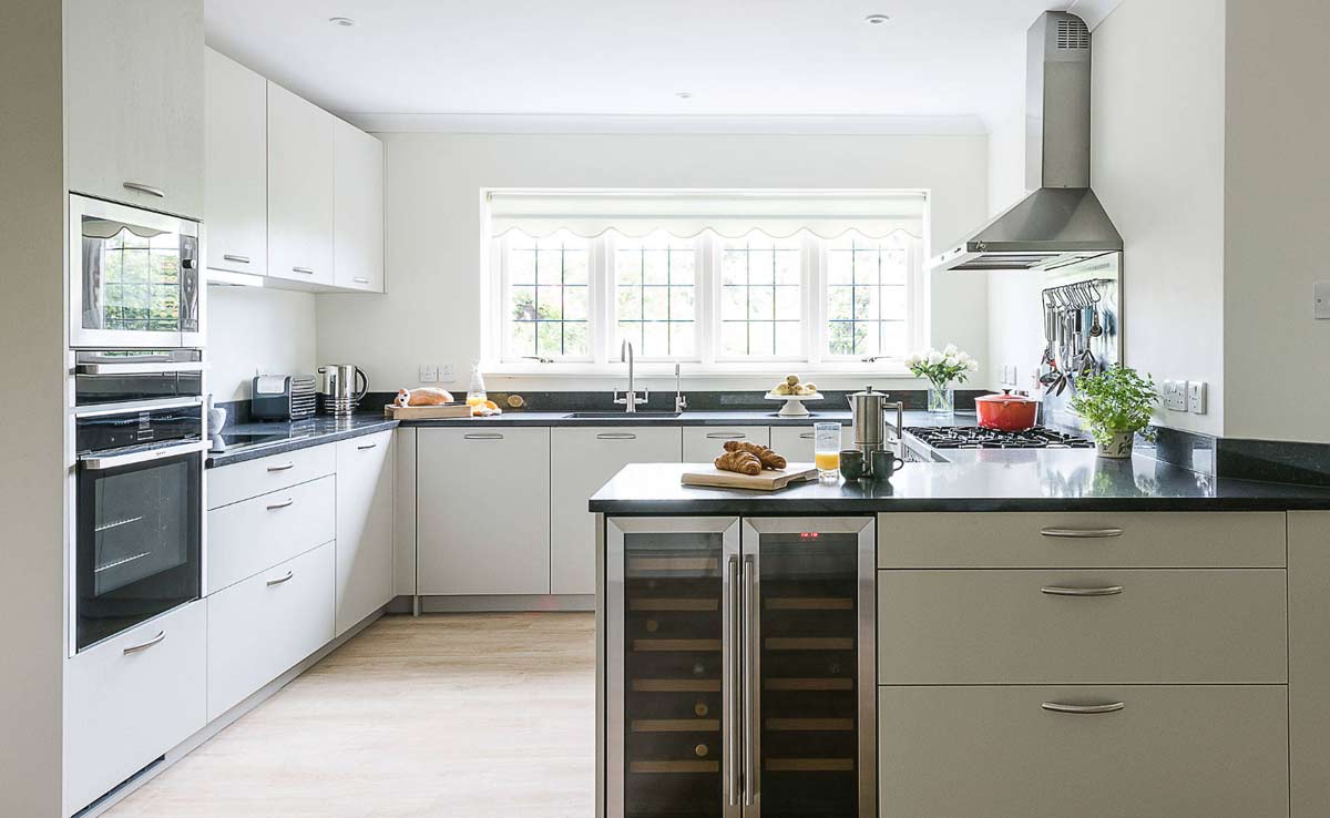 we provide beautiful designer modular kitchen with inbuilts and inbuilt bar cabinets and wine chiller