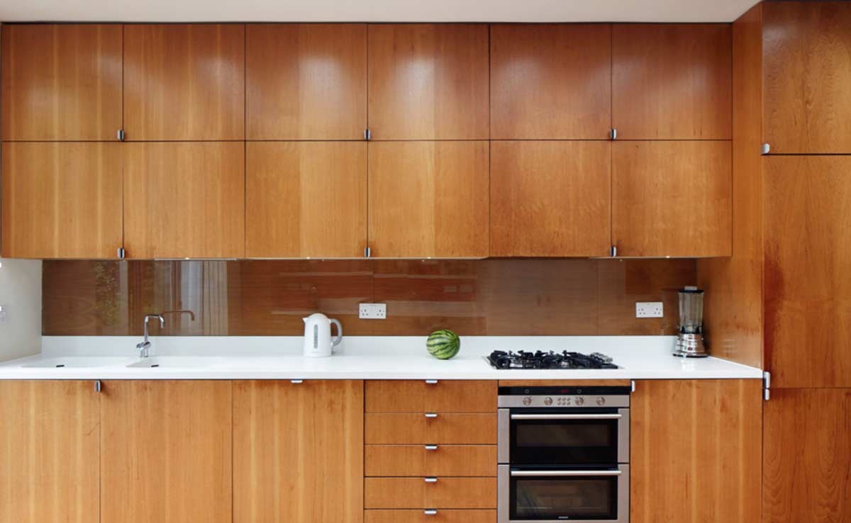 brown modular kitchen cabinets till roof installed in gurgaon