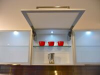 servo drive automatic fitting by blum installed by design indian kitchen company noida and delhi