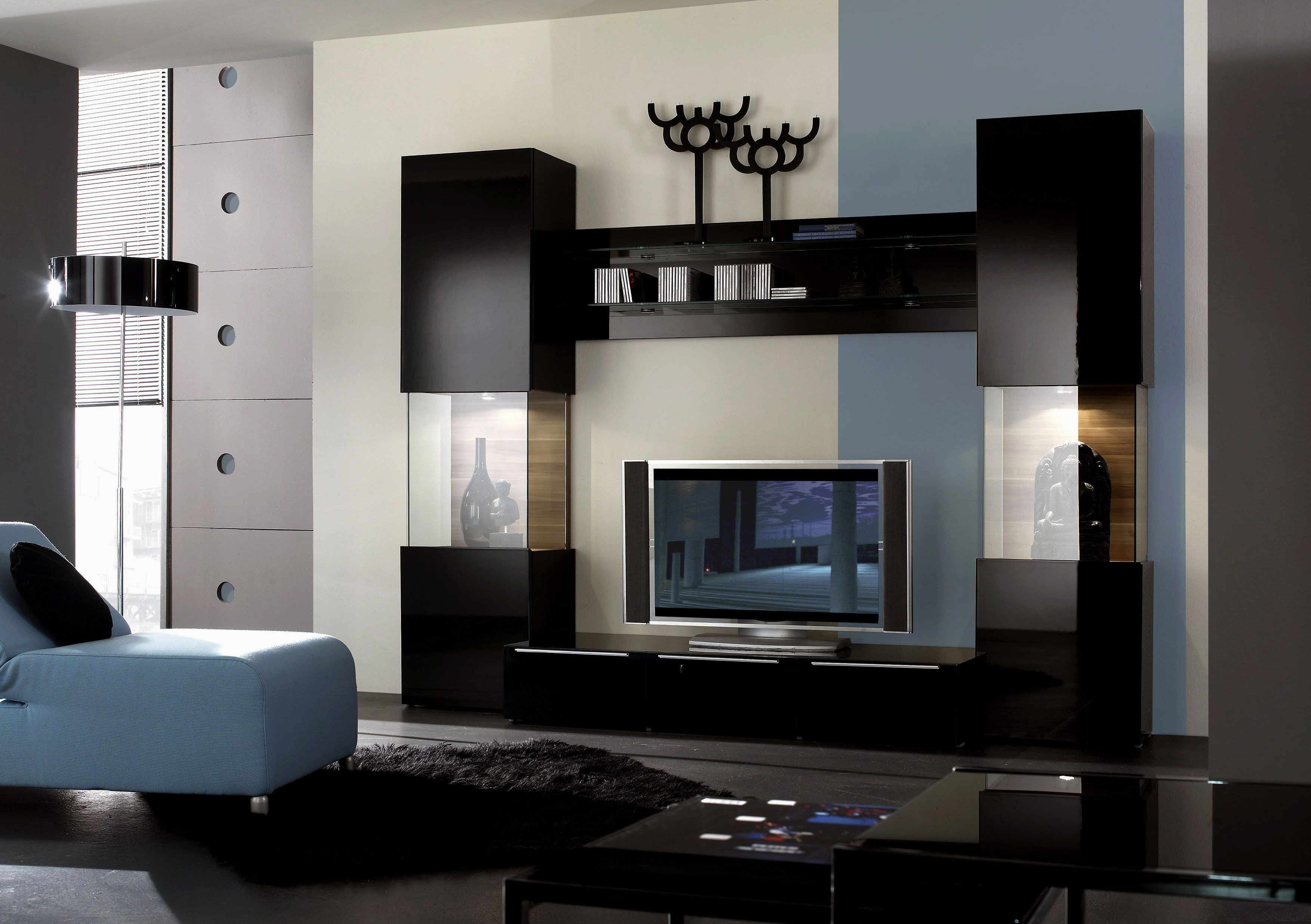 a brillant tv unit in black with lacquer glass and clear glass combination with top shelves for books